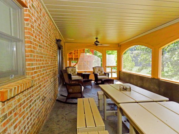 smith mountain lake virginia screen porch curved archway stone flooring