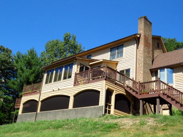 smith mountain lake virginia screen porch curved archway stone flooring