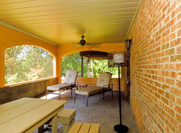 smith mountain lake virginia screen porch curved archway stone flooring